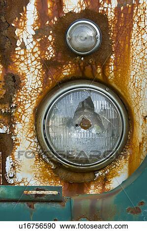 Stock Image - rusty, headlight, delapedated, unfit, headlamp, broken. Fotosearch