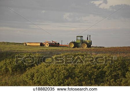 Stock Photography - saskatchewan, equipment, scenic, field, idle, farm. Fotosearch