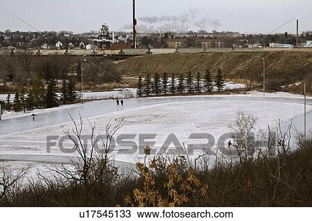Stock Image - saskatchewan, skating, jaw, moose, oval, people. Fotosearch