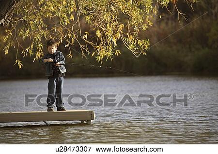 scenic, boy, dock, off, fishing, young View Large Photo Image Stock Photo - scenic, boy, dock, off, fishing, young. Fotosearch