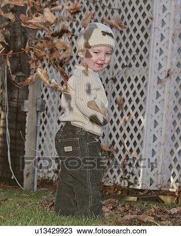 scenic, boy, leaves, autumn, playing, young View Large Photo Image Stock Image - scenic, boy, leaves, autumn, playing, young. Fotosearch