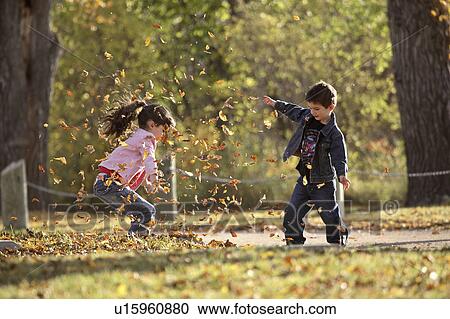 scenic, tossing, leaves, autumn, up, siblings View Large Photo Image Stock Image - scenic, tossing, leaves, autumn, up, siblings. Fotosearch