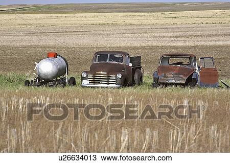 Stock Image - scenic, vehicles, field, tank, water, abandoned. Fotosearch