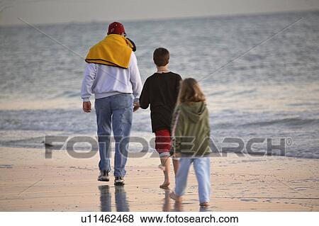 scenic, walking, beach, kids, children, father View Large Photo Image Stock Photo - scenic, walking, beach, kids, children, father. Fotosearch