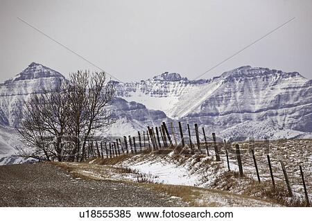 Stock Photography - snow, mountains, highway, road, winter, rocky. Fotosearch