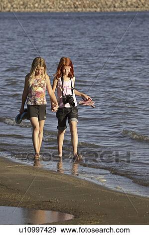 southeast, young, beach, walking, girls, two View Large Photo Image Stock Photo - southeast, young, beach, walking, girls, two. Fotosearch