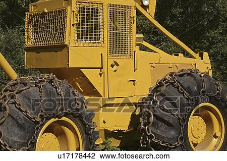 Stock Image - tire, machine, canada, saskatchewan, scenic, logging. Fotosearch
