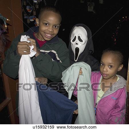 Stock Photo - treaters, american, trick, kids, halloween, african. Fotosearch