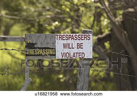 Stock Photo - trespassing, saskatchewan, scenic, sign, humorous. Fotosearch