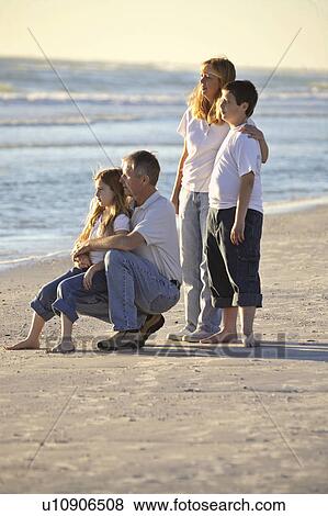 Stock Photo - usa, enjoying, florida, scenic, beach, family. Fotosearch
