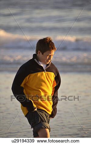 Stock Photo - usa, enjoying, florida, scenic, beach, boy. Fotosearch
