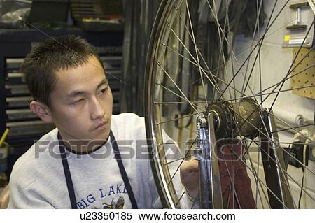 Stock Photography - wheel, american, bike, making, worker, asian. Fotosearch