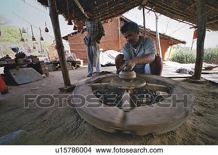 Picture - wheel, pot, potters, potter, pottery, clay. Fotosearch