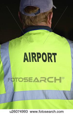 yellow, sign, jacket, vest, holder, airport View Large Photo Image Stock Image - yellow, sign, jacket, vest, holder, airport. Fotosearch