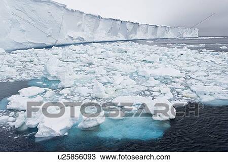 A huge tabular iceberg and brash ice near the Antarctic Peninsula. View Large Photo Image Stock Image - A huge tabular iceberg and brash ice near the Antarctic Peninsula.. Fotosearch