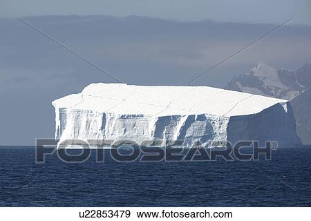 A massive tabular iceberg off the coast of Elephant Island in the South Shetland Island Group, Antarctica. View Large Photo Image Stock Photo - A massive tabular iceberg off the coast of Elephant Island in the South Shetland Island Group, Antarctica.. Fotosearch