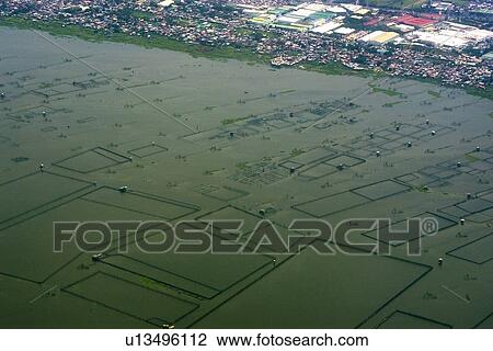 Stock Image - Aerial view of aquaculture facilities next to Manila, Philippines. Fotosearch