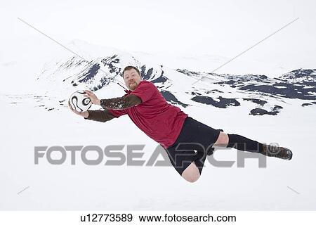 Stock Photo - Chief Officer Bernd of the Lindblad Expedition ship National Geographic Endeavour at play in Antarctica.. Fotosearch