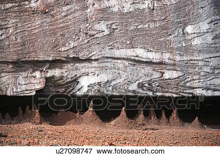 Close up views of glacial ice and ash after the 1969 eruption on Deception Island in Antarctica. Note the suspended ash being deposited in small stalagmites as the ice melts. View Large Photo Image Stock Photo - Close up views of glacial ice and ash after the 1969 eruption on Deception Island in Antarctica. Note the suspended ash being deposited in small stalagmites as the ice melts.. Fotosearch