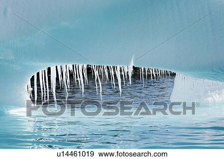 Detail of a melting iceberg (note the dripping icicles) grounded at Heroina Island in the Weddell Sea, Antarctica. View Large Photo Image Stock Photo - Detail of a melting iceberg (note the dripping icicles) grounded at Heroina Island in the Weddell Sea, Antarctica.. Fotosearch