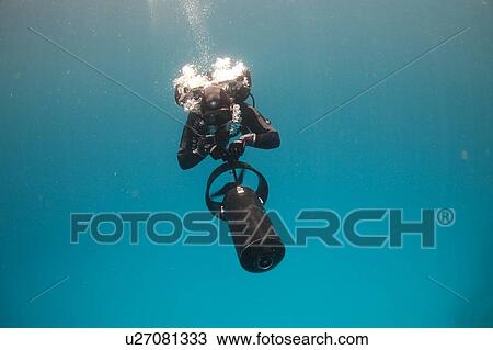 Diver with scooter. Hurghada, Red Sea, Egypt. (rr) View Large Photo Image Stock Image - Diver with scooter. Hurghada, Red Sea, Egypt. (rr). Fotosearch