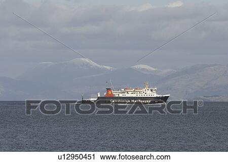 Ferry running between islands with snow-capped Ben Nevis, the UK's highest mountain, on mainland behind. Hebrides, UK View Large Photo Image Stock Image - Ferry running between islands with snow-capped Ben Nevis, the UK's highest mountain, on mainland behind. Hebrides, UK. Fotosearch
