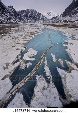 Frozen river, Auyuittuq National Park, Pangirtung Fjord, Baffin Island, Canadian High Arctic View Large Photo Image Stock Photograph - Frozen river, Auyuittuq National Park, Pangirtung Fjord, Baffin Island, Canadian High Arctic. Fotosearch