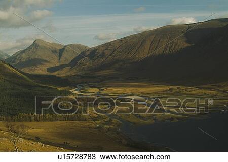 Glen Etive Valley and top of Loch Etive from high view point in Autumn featuring sun breaking through broken cloud., Scotland View Large Photo Image Stock Image - Glen Etive Valley and top of Loch Etive from high view point in Autumn featuring sun breaking through broken cloud., Scotland. Fotosearch