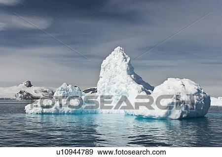 Stock Photo - Huge iceberg near Petermann Island on the west side of the Antarctic Peninsula.. Fotosearch
