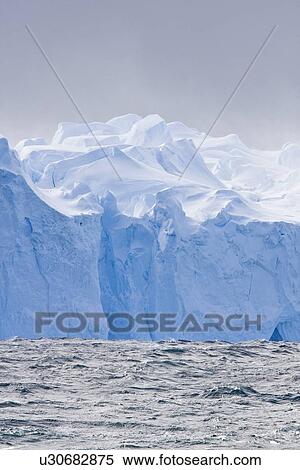 Iceberg detail in and around Crystal Sound near the Antarctic Circle on the Antarctic Peninsula during the summer months. More icebergs are being created as global warming is causing the breakup of major ice shelves and glaciers. View Large Photo Image Stock Photography - Iceberg detail in and around Crystal Sound near the Antarctic Circle on the Antarctic Peninsula during the summer months. More icebergs are being created as global warming is causing the breakup of major ice shelves and glaciers.. Fotosearch