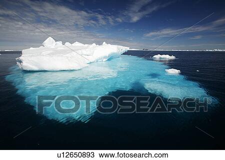 Iceberg detail in and around the Antarctic Peninsula during the summer months. More icebergs are being created as global warming is causing the break up of major ice sheets. View Large Photo Image Stock Image - Iceberg detail in and around the Antarctic Peninsula during the summer months. More icebergs are being created as global warming is causing the break up of major ice sheets.. Fotosearch