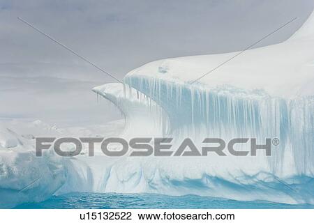 Iceberg detail in and around the Antarctic Peninsula during the summer months. More icebergs are being created as global warming is causing the breakup of major ice shelves and glaciers. View Large Photo Image Stock Image - Iceberg detail in and around the Antarctic Peninsula during the summer months. More icebergs are being created as global warming is causing the breakup of major ice shelves and glaciers.. Fotosearch