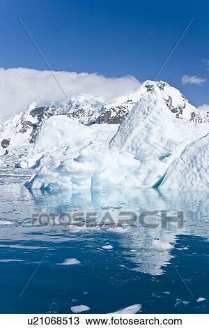 Iceberg detail in and around the Antarctic Peninsula during the summer months. More icebergs are being created as global warming is causing the breakup of major ice shelves and glaciers. View Large Photo Image Stock Image - Iceberg detail in and around the Antarctic Peninsula during the summer months. More icebergs are being created as global warming is causing the breakup of major ice shelves and glaciers.. Fotosearch