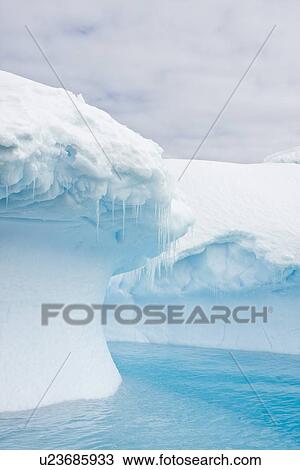 Stock Image - Iceberg detail in and around the Antarctic Peninsula during the summer months. More icebergs are being created as global warming is causing the breakup of major ice shelves and glaciers.. Fotosearch