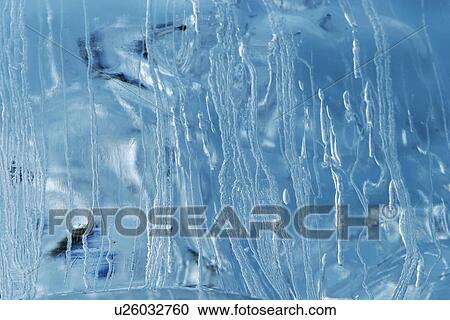 Stock Image - Iceberg detail in and around the Antarctic Peninsula during the summer months. More icebergs are being created as global warming is causing the break up of major ice sheets.. Fotosearch