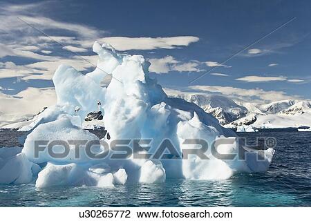 Stock Image - Iceberg detail in and around the Antarctic Peninsula during the summer months. More icebergs are being created as global warming is causing the breakup of major ice shelves and glaciers.. Fotosearch