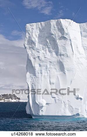 Iceberg detail in and around the Antarctic Peninsula during the summer months. More icebergs are being created as global warming is causing the breakup of major ice shelves and glaciers. View Large Photo Image Stock Photo - Iceberg detail in and around the Antarctic Peninsula during the summer months. More icebergs are being created as global warming is causing the breakup of major ice shelves and glaciers.. Fotosearch