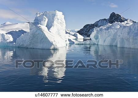 Iceberg detail in and around the Antarctic Peninsula during the summer months. More icebergs are being created as global warming is causing the breakup of major ice shelves and glaciers. View Large Photo Image Stock Photo - Iceberg detail in and around the Antarctic Peninsula during the summer months. More icebergs are being created as global warming is causing the breakup of major ice shelves and glaciers.. Fotosearch