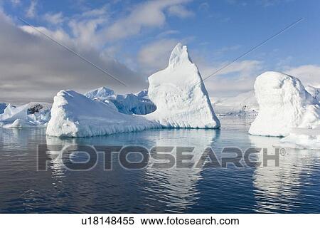 Stock Photography - Iceberg detail in and around the Antarctic Peninsula during the summer months. More icebergs are being created as global warming is causing the breakup of major ice shelves and glaciers.. Fotosearch