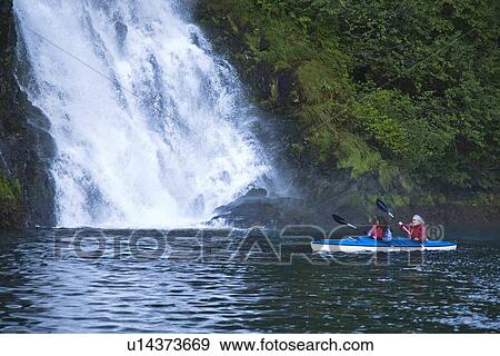 Kayaking in Red Bluff Bay on Baranof Island in Southeast Alaska, USA. Pacific Ocean. Kayak property release is DB051905. No model release. View Large Photo Image Stock Photo - Kayaking in Red Bluff Bay on Baranof Island in Southeast Alaska, USA. Pacific Ocean. Kayak property release is DB051905. No model release.. Fotosearch
