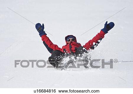 Lindblad Expeditions guests sliding down a hill on their snow pants in Antarctica as part of expedition travel. NO MODEL RELEASES FOR THIS IMAGE. View Large Photo Image Stock Photograph - Lindblad Expeditions guests sliding down a hill on their snow pants in Antarctica as part of expedition travel. NO MODEL RELEASES FOR THIS IMAGE.. Fotosearch