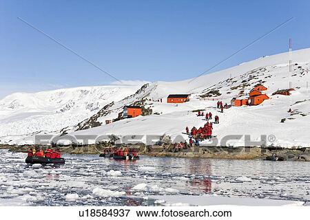 Lindblad Expeditions guests visiting the Argentine research station Almirante Brown in Paradise Bay in Antarctica as part of expedition travel. NO MODEL RELEASES FOR THIS IMAGE. View Large Photo Image Stock Photo - Lindblad Expeditions guests visiting the Argentine research station Almirante Brown in Paradise Bay in Antarctica as part of expedition travel. NO MODEL RELEASES FOR THIS IMAGE.. Fotosearch