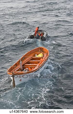 Rescue operation for sinking ship MV Explorer in Antarctica. View Large Photo Image Stock Image - Rescue operation for sinking ship MV Explorer in Antarctica.. Fotosearch