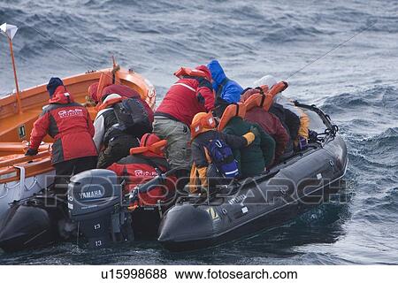 Stock Photo - Rescue operation for sinking ship MV Explorer in Antarctica.. Fotosearch