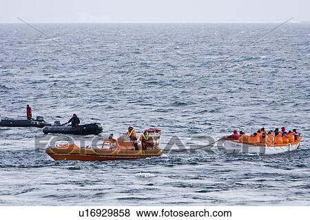 Stock Photo - Rescue operation for sinking ship MV Explorer in Antarctica.. Fotosearch