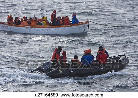 Rescue operation for sinking ship MV Explorer in Antarctica. View Large Photo Image Stock Photo - Rescue operation for sinking ship MV Explorer in Antarctica.. Fotosearch