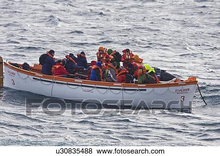 Stock Photo - Rescue operation for sinking ship MV Explorer in Antarctica.. Fotosearch