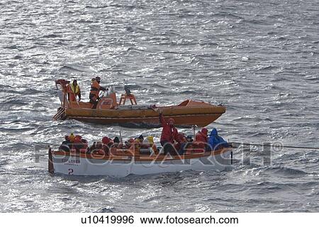 Stock Photograph - Rescue operation for sinking ship MV Explorer in Antarctica.. Fotosearch