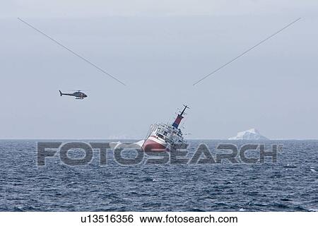 Rescue operation for sinking ship MV Explorer in Antarctica. View Large Photo Image Stock Photograph - Rescue operation for sinking ship MV Explorer in Antarctica.. Fotosearch