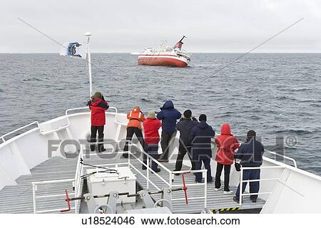 Stock Photograph - Rescue operation for sinking ship MV Explorer in Antarctica.. Fotosearch